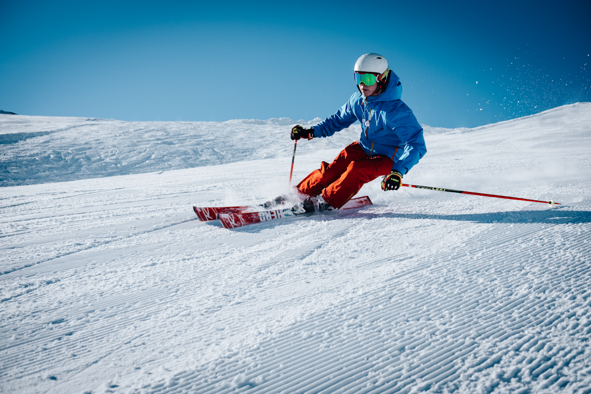 US freeski rider doing freestyle trick in powder